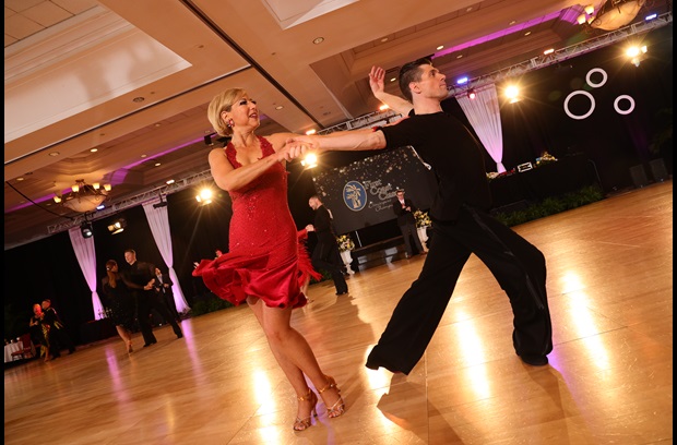 Gail ballroom dancing in a red dress