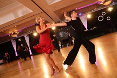 Gail ballroom dancing in a red dress