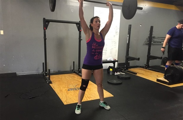 Photo of Rachelle lifting weights