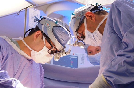 Wilson Szeto, MD, and Michael Acker, MD, performing cardiac surgery