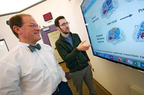 Brian Litt, MD, pictured with John Bernabei, MD, PhD, (right), is exploring the use of virtual cortical resection as a means of guiding epilepsy surgery.