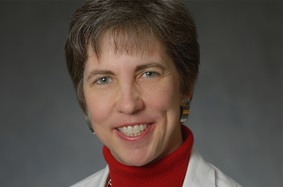 Headshot of Dr. Kristy Weber of Penn Orthopaedics in a white lab coat
