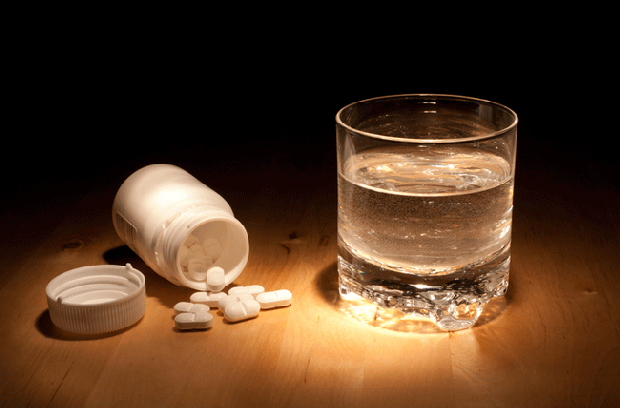 medicine and a glass of water