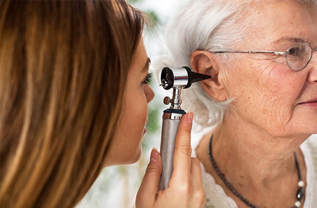 Older woman is examined by an ENT