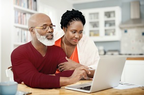 Mature couple looking at computer together