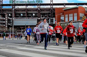 People running in a 5k outside Citizens Bank Park
