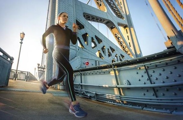 woman running at bridge