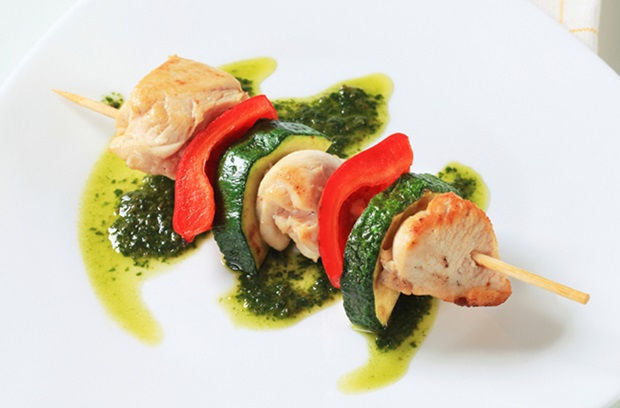Chicken and vegetable skewer with pesto sauce