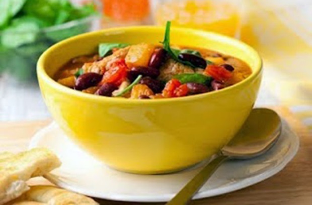 Yellow bowl filled with vegetables and meat