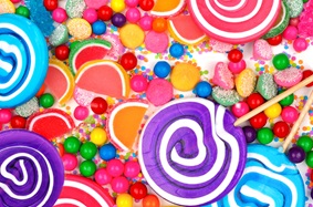 Colorful lollipops, gumballs, gummies, rock candy, sprinkles, and more