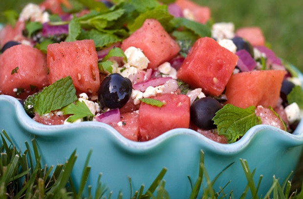 Sweet and light watermelon salad with mint, onions, olives and crumbled feta cheese