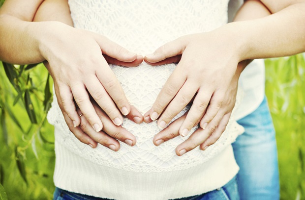 Hands on pregnant belly