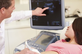 Pregnant woman viewing ultrasound
