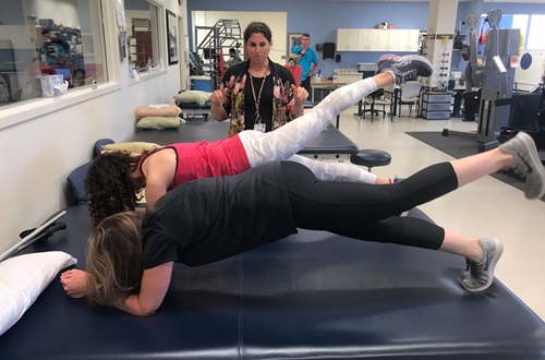Two women doing physical therapy