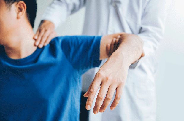 Provider holding patient's shoulder and arm