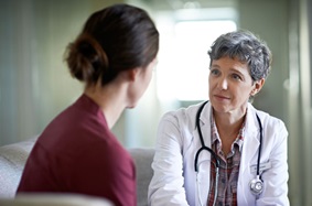 Physician meeting with a patient