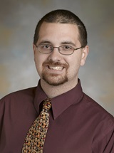 headshot of Adam G. Biuckians, MD