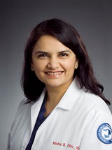 headshot of Nisha S. Dhir, MD