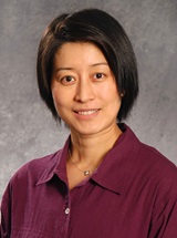 headshot of Xingjia (Ginger) Hua, MD