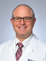 headshot of Adam D. Redlich, MD