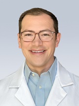 headshot of Erik O. Saka, MD, MBE
