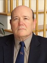 headshot of John J. Shelmet, MD