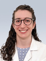 headshot of Eva Paige Szymanski, MD