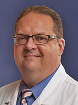 headshot of Kenneth R. Tomkovich, MD