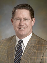 headshot of Christopher A. Woodard, MD