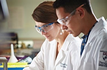 two Penn researchers in lab