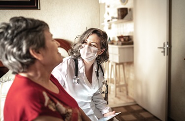 provider talking to patient in home