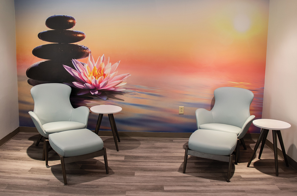 One of Chester County Hospital’s Renewal Center rooms with sunset mural on wall